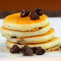 Chocolate Chip Pancakes · Fluffy, buttery, light pancakes marbled with chocolate chips. Served with maple syrup.