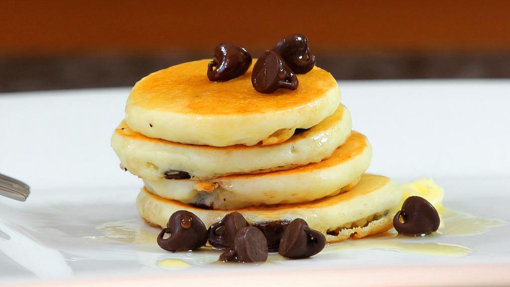 Chocolate Chip Pancakes · Fluffy, buttery, light pancakes marbled with chocolate chips. Served with maple syrup.