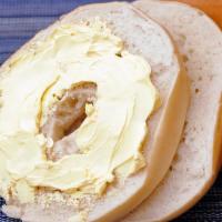 Bagel With Butter · Fresh, plain bagel with a generous schmear of real butter.
