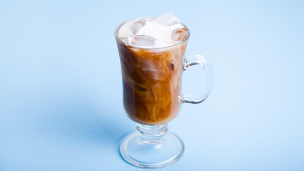 Iced Latte · Deep, dark espresso shots with steamed milk over ice.