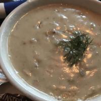 New England Clam Chowder · With bacon, potatoes, and fresh thyme.