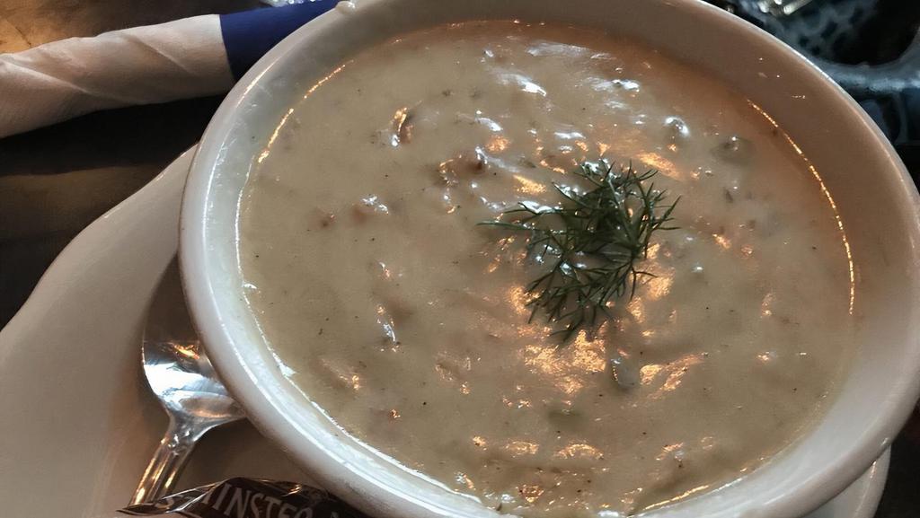 New England Clam Chowder · With bacon, potatoes, and fresh thyme.