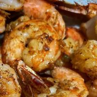 Grilled Shrimp · 6 large shrimp perfectly seasoned with old bay and a house spice blend, served with fresh le...