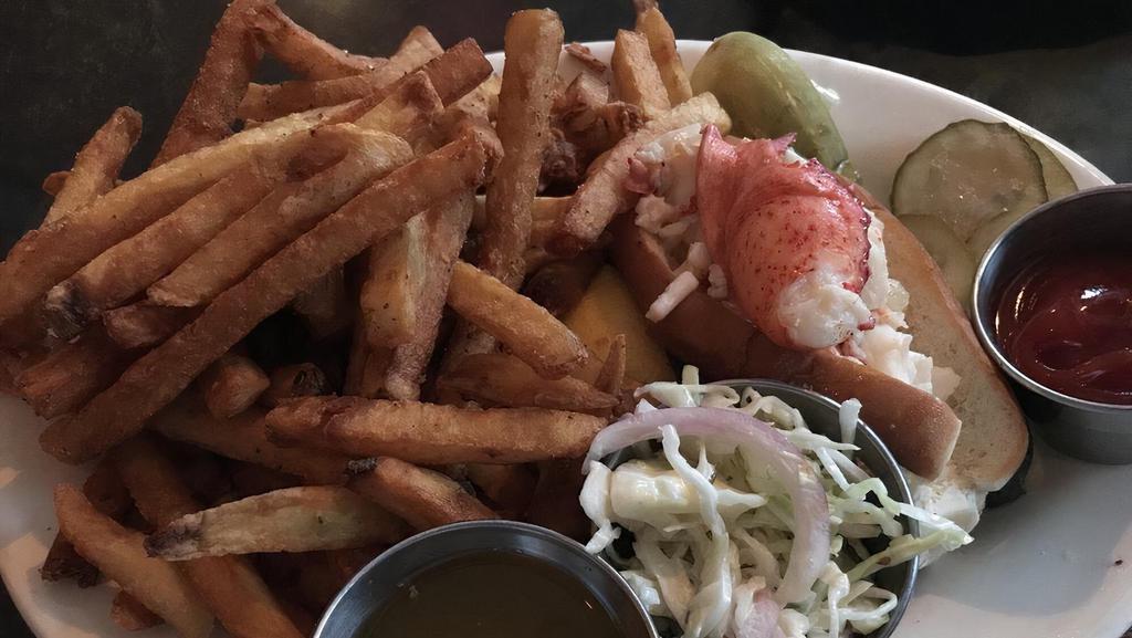 Lobster Roll · Maine or Connecticut style, served on a buttered split-top roll with side of Old Bay fries and house pickles.