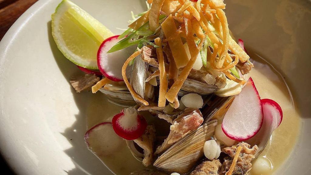 Pork & Clams Pozole · Slow roasted pork shoulder and Littleneck clams in pork and dash bone broth, with hominy, cabbage, crispy tortilla strips and spicy salsa matcha on the side.
