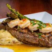 Land & Sea  · 14 oz New York Strip, (3) Jumbo Grilled Shrimp served with mashed potatoes