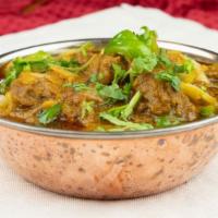 Kadai Meat · Diced meat cooked with onion, green pepper, fresh tomatoes, mustard seeds, & spices.