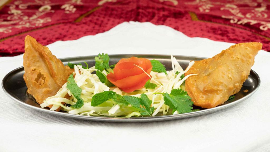 Vegetable Samosa - 2 Pcs. · Seasoned potatoes and green peas encased in a crisp pastry and fried.