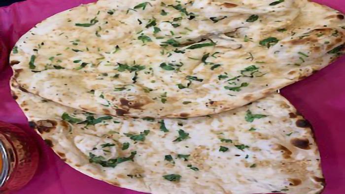 Cheese Naan · Naan stuffed with mozzarella cheese, chopped onions & tomatoes with cilantro.
