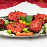 Tandoori Chicken (5Pc) · Chicken marinated in yogurt, garlic, ginger, spices & fresh herbs.
