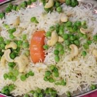 Pulao Rice · Basmati rice cooked with peas and potatoes.