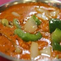 Chicken Tikka Masala · Boneless chicken from oven cooked with onion, green peppers, tomato sauce, & cream.