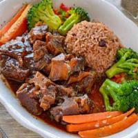 Island Spiced Oxtail · Savory Oxtails, Cooked to Perfection with a Savory Touch.