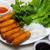 Crispy Spring Rolls · A mixture of chopped shrimps, crab meat, pork hash and vegetables wrapped in rice lumpia and...