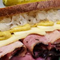 The Reuben · Hot pastrami, turkey or corned beef, melted swiss. sauerkraut and russian dressing on toaste...