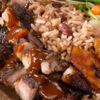 Jerk Pork Meal · Served with rice and peas or white rice and steamed vegetables and plantains.