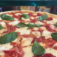 Margarita Pizza · Fresh Mozzarella, Plum Tomatoes, Basil and Olive Oil.