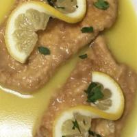 Veal Piccata · Veal Cutlet Sautéed with Capers, Artichoke Hearts, Lemon zest, White Wine, in a light Butter...