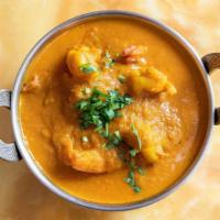 Shrimp Curry · Served w/ Basmati Rice. Shrimp cooked w. Spice flavored sauce.