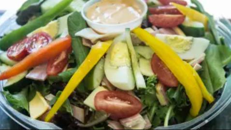 Traditional Chef'S Salad · Turkey, ham, Swiss and American cheese, hard boiled egg and cucumber over mixed greens.