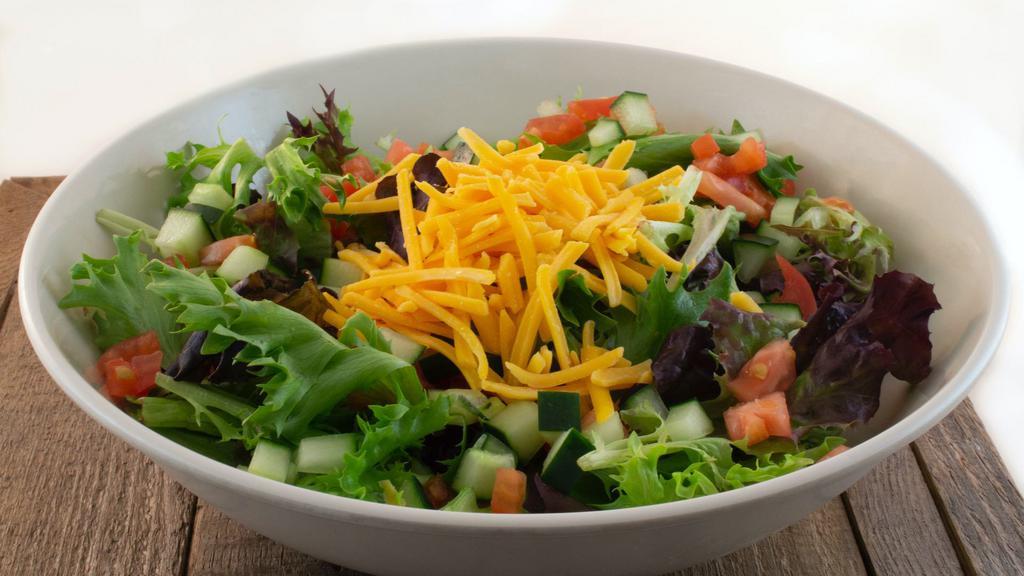 Garden Salad · Spring Mix, tomato, cucumbers, shredded cheese and choice of dressing