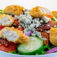 Southern Fried Chicken Salad · Spring Mix, fried chicken, blue cheese crumbles, bacon, red onion, tomatoes, cucumbers with ...