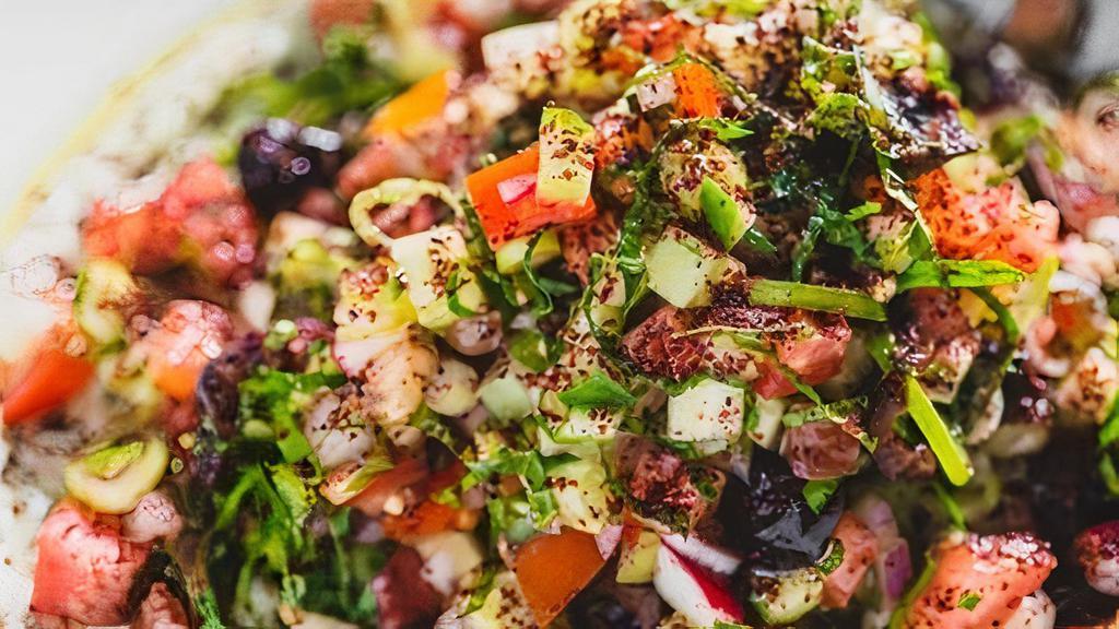 Israeli Salad · Cucumbers, Tomatoes, Red Onion, Fresh Herbs, Radish, Olives, Tahini, Sumac