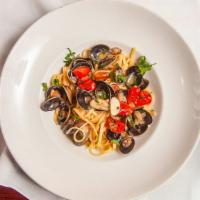 Linguine With Clams · Chopped Clams | Roasted Garlic White Wine Sauce