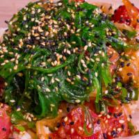 Classic Shoyu · TUNA/SALMON with onions, scallions, marinated in Citrus Ponzu topped with seaweed salad & fu...