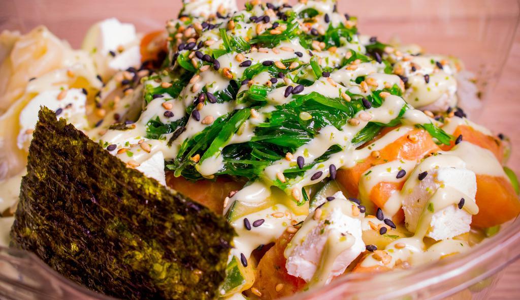 Gateway · Salmon with cucumber & edamame, marinated in wasabi ponzu, topped with pickled ginger, furikake, nori, cream cheese, with wasabi mayo drizzle.
