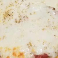 Greek Pizza · Mozzarella, tomato sauce, spinach and feta cheese on a crispy pita bread