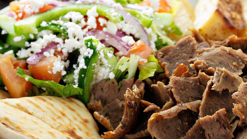 Traditional (Beef & Lamb) Gyro - Plate · Thinly sliced beef and lamb (combination) gyro meat, cooked with fresh herbs & spices. Served with choice of 2 sides, pita bread and choice of sauce.
