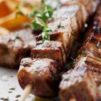Pork Souvlaki - Plate · Cubed pieces of pork on skewers cooked with fresh herbs & spices. Served with choice of 2 si...