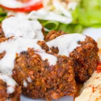 Falafel - Plate · Ground chickpea cooked with fresh herbs & spices. Served with choice of 2 sides, pita bread ...