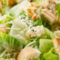 Caesar Salad · Romaine lettuce, grated parmesan cheese & croutons, topped with Caesar dressing.