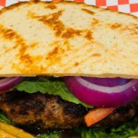 Classic Bifteki Burger · Bifteki patty served with lettuce, tomatoes and onions inside toasted pita bread, and french...