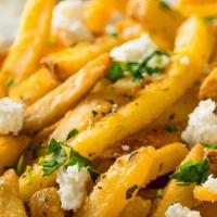 Greek Fries · Freshly cut French fries, topped with feta cheese, salt & oregano.