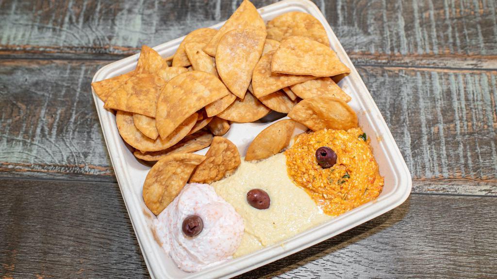 Tasting Trio · Pick any 3 spreads and enjoy with our crispy pita chips.