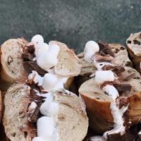 S'Mores Bagel · Nutella cream cheese, Nutella spread, Hershey's chocolate pieces, and marshmallow fluff topp...