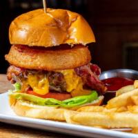 Tavern Burger · Lettuce, cheddar, American bacon, tomato, and onion rings.