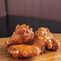 10 Wings · 10 wings tossed in sauce of your choice!