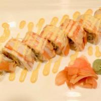 Phoenix Roll · Shrimp tempura inside topped with crab with shrimp sauce.