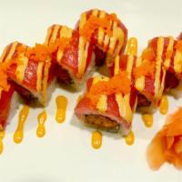 Tiger Roll · Spicy tuna, crunchy topped with tuna and masago with spicy sauce.