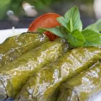 Yaprak Sarmasi / Stuffed Grape Leaves · Grape leaves stuffed with rice, pine nuts, currents and chef's secret spices.