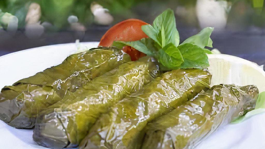 Yaprak Sarmasi / Stuffed Grape Leaves · Grape leaves stuffed with rice, pine nuts, currents and chef's secret spices.