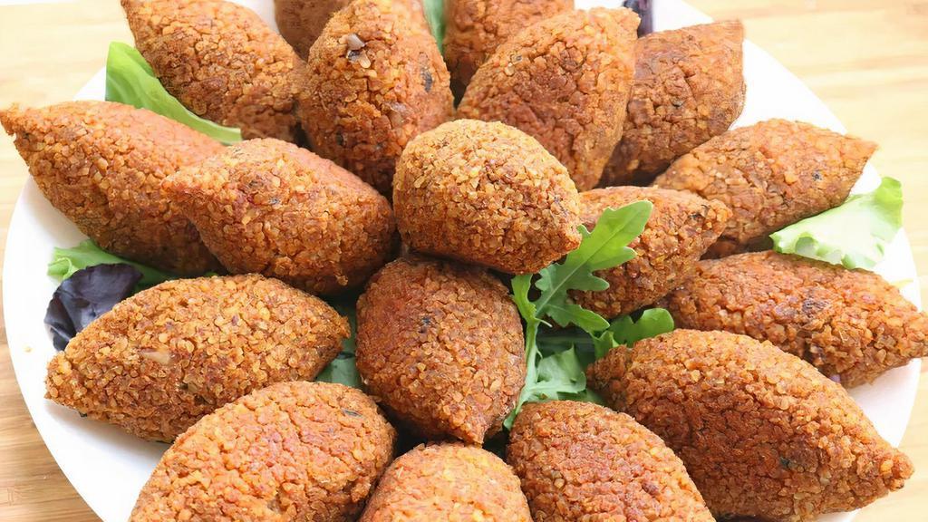 Kibbeh (2) · Bulgar wheat balls stuffed with ground beef, pine nuts and mediterranean herbs and spices.