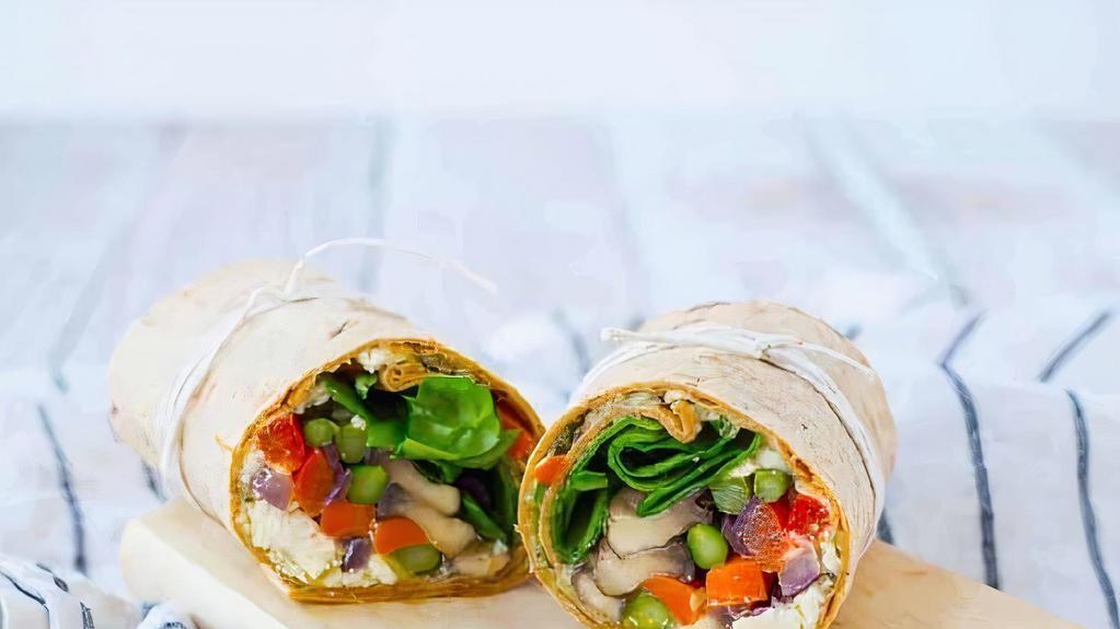 Vegetable Wrap · Char grilled seasonal vegetables lightly seasoned with mediterranean spices, hummus, roasted pine nuts, chopped onions and red pepper tightly rolled in a house made tortilla served with house made french fries.