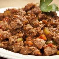 Dana Sotesi / Beef Sauté · Tender pieces of filet sauteed with onions, peppers and garlic in a fresh tomato sauce serve...