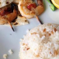Karides Izgara / Jumbo Shrimp · Char grilled to perfection seasoned with vinegar, salt, pepper and parsley served over rice ...