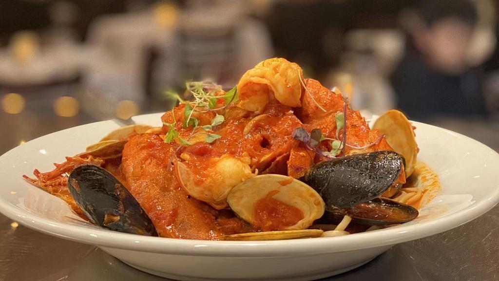 Seafood Fra Diavolo  · Mussels, Clams, Shrimp, Calamari & Scallops in a Spicy Marinara Sauce